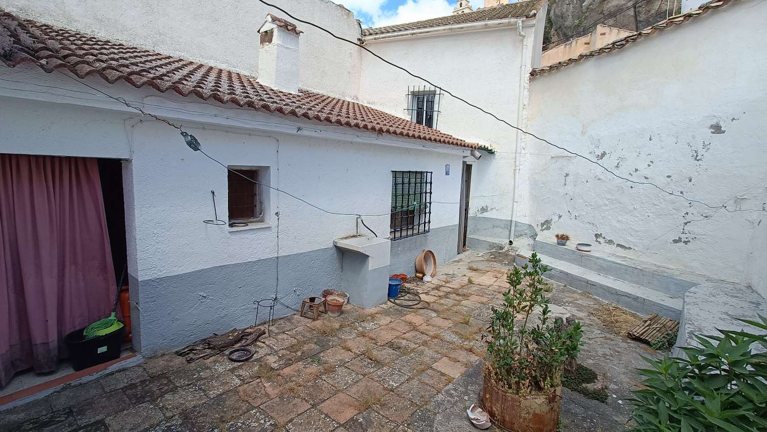 Typical village house with private patio and many possibilities